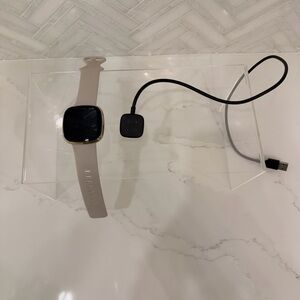 Fitbit Versa 3 Smartwatch with Light Beige Band and Charger